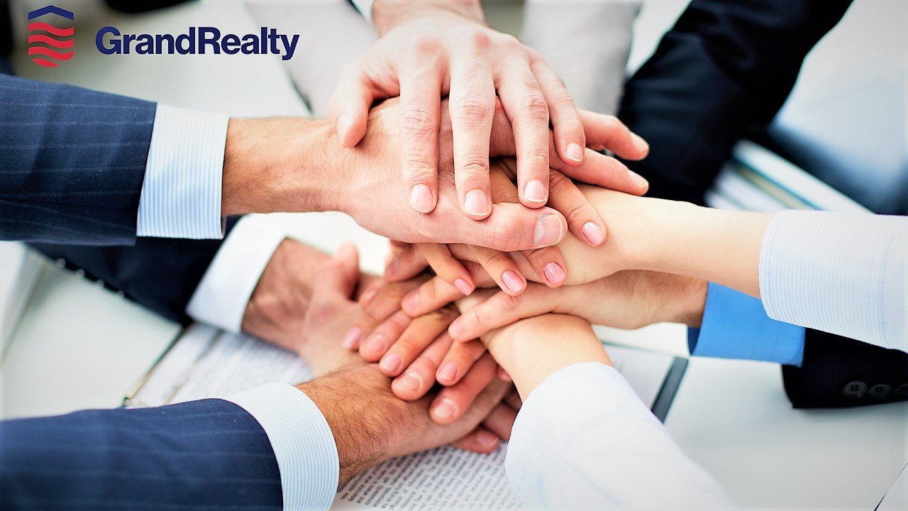 Real estate professionals working together on a transaction